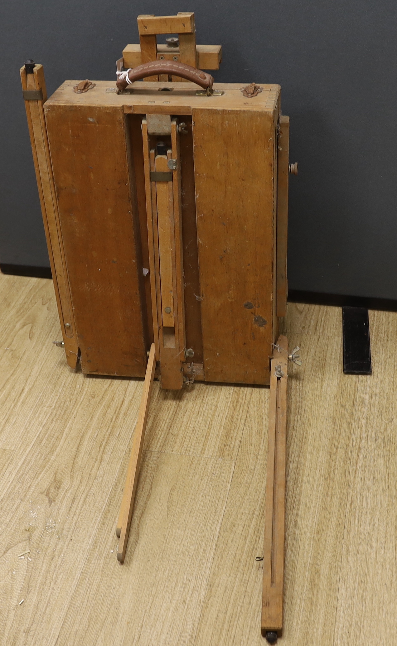 A travelling easel stamped ‘M abef made in Italy’